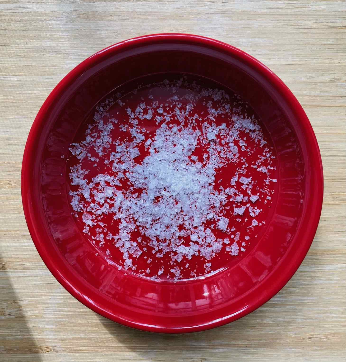 flaky sea salt in a red dish